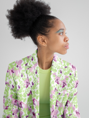 black woman in floral blazer