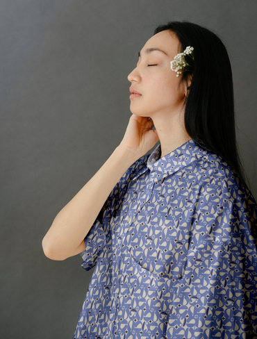woman in vintage pattern shirt